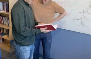 two people reading a book